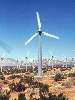 Wind turbines dot the open space landscape