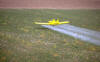 Chemicals - pesticides being sprayed on fields from cropduster