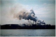 Coal-burning factories emitting toxins into atmosphere